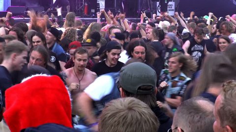 HELSINKI, FINLAND - JUNE 01, 2016: A lot of fans applauding and waving their hands at a rock concert. Heavy metal rock festival Tuska.