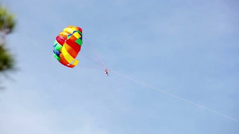Parachute hauled by the motorboat flying in the sky