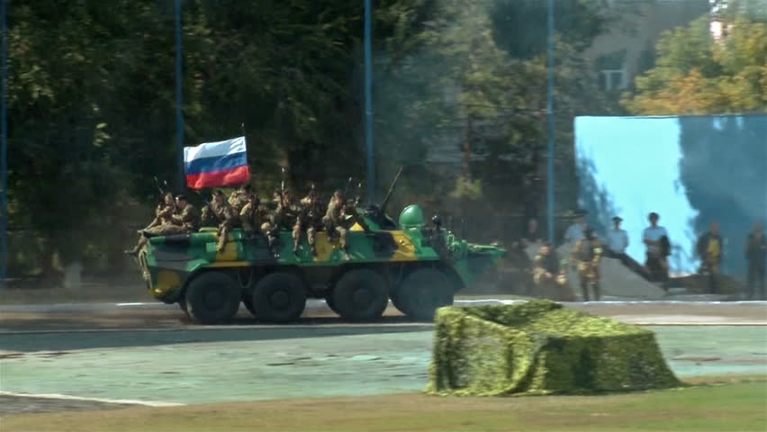 Russian special forces. Soldiers moving by tank