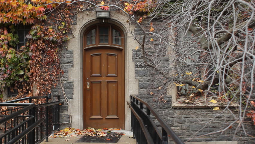 Door. Wooden door at entrance to brick building. Toronto, Ontario, Canada. 
