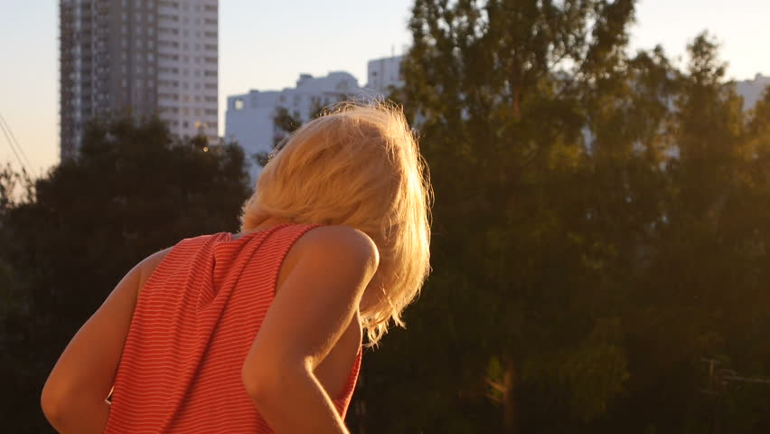 Shy Blond Girl Look at the Summer Sunset Smiling in Slow Motion