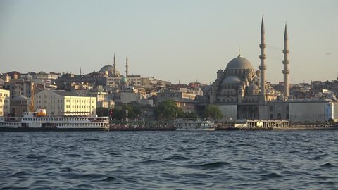 The view of Yeni Cami (New Mosque) originally named the Valide Sultan Mosque (Valide Sultan Camii)  over Golden Horn bay, Istanbul, Turkey
