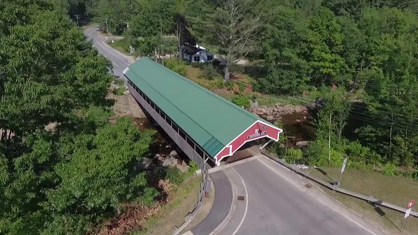 New England Covered Bridge as seen in New Hampshire or Vermont. Descending Boom Camera Movement