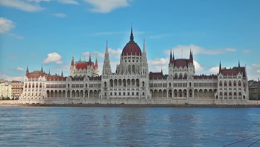 Budapest Hungarian parliament on the bank of Danube river in Hungary in clouds and sunlight timelapse