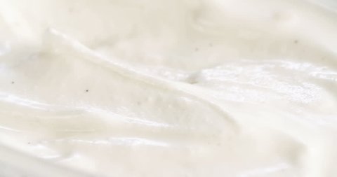 Macro shot of a teaspoon scooping ice cream