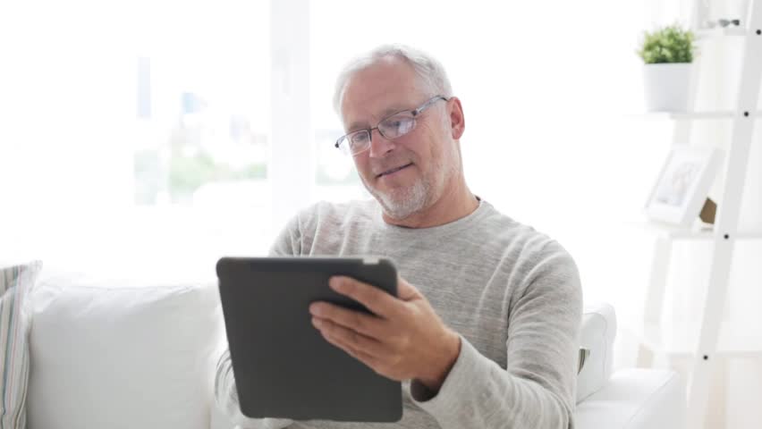 Technology, people and lifestyle, distance learning concept - senior man with tablet pc computer at home | Shutterstock HD Video #18237388