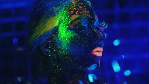 girl painted fluorescent powder ultraviolet light