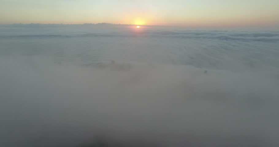 Aerial Flying Through Clouds at Sunset in Sea Point, Cape Town
