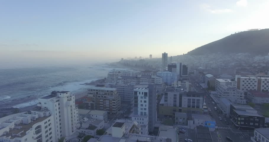 Aerial View Flying Over Buildings at Misty Sunrise in Cape Town