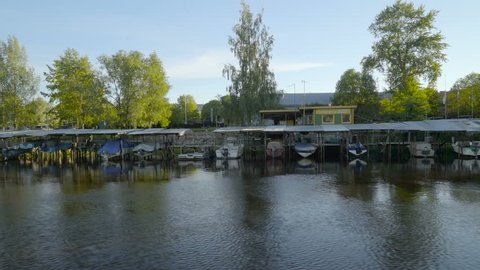 Line of boats on the hut in the river in Tartu Estonia
