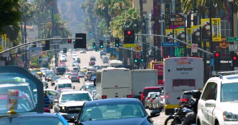 LOS ANGELES, CALIFORNIA, USA - JULY 3, 2016: Traffic jam on Hollywood Boulevard during the heat wave, heat distortion on background on July 3, 2016 in Los Angeles, California, 4K, from RAW
