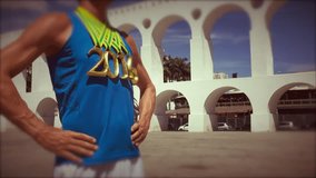 First place athlete wearing 2016 gold medals standing at Arcos da Lapa Arches in Rio de Janeiro, Brazil 