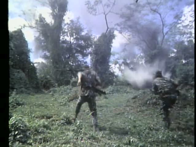 Rear view explosions knocking down troops