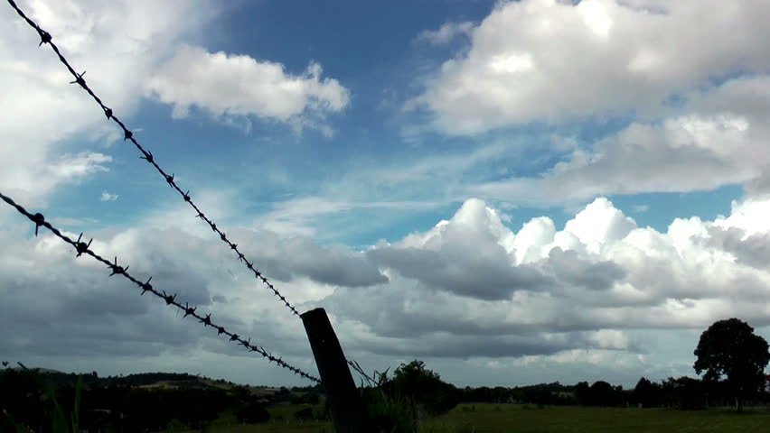 TIME LAPSE - Barbed wire and clouds - AUSTRALIA