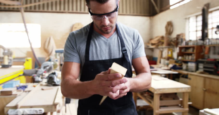 Two carpenters working on their craft in a work shop Royalty-Free Stock Footage #18271447