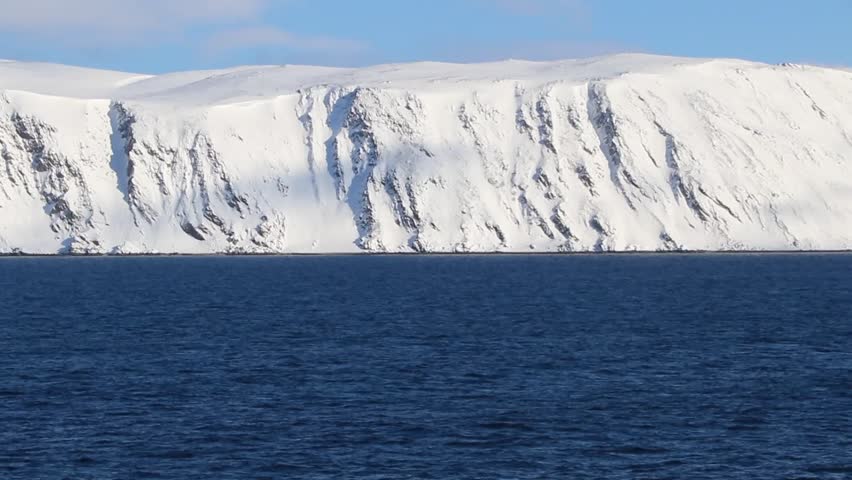 White mountains from a ship in the North of Norway