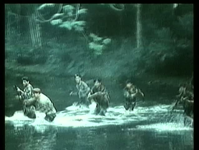 Wide shot soldiers crossing river