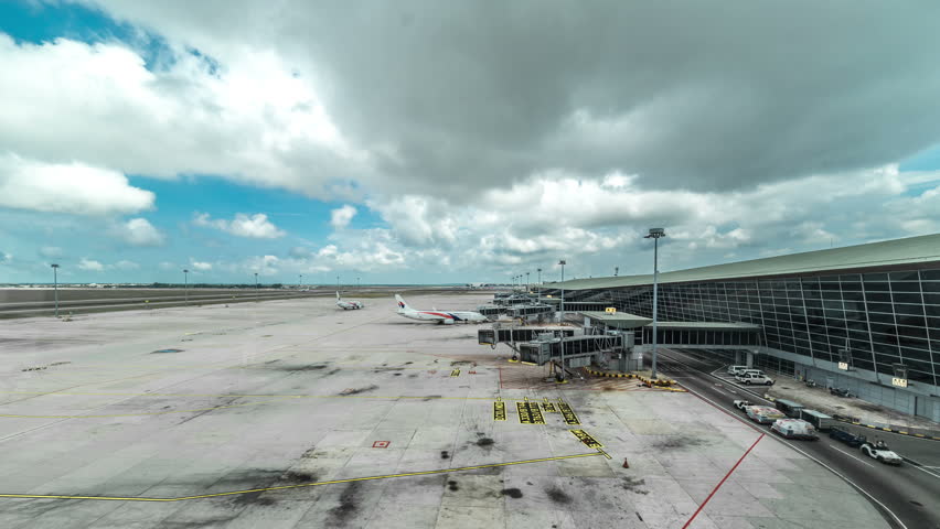 Planes preparing for boarding at Kuala Lumpur International Airport. 4K Timelapse - Kuala Lumpur, Malaysia, June 2016.