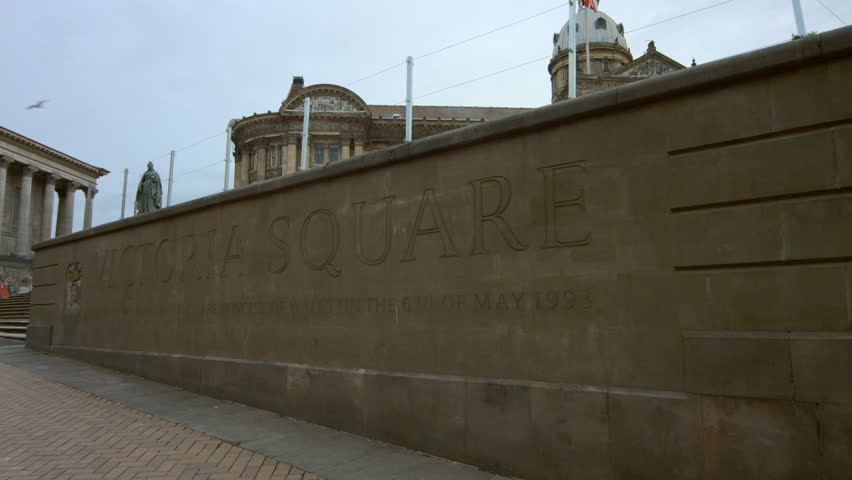 Birmingham, England - Victoria Square early morning. Low angle panning shot of the wall with the square