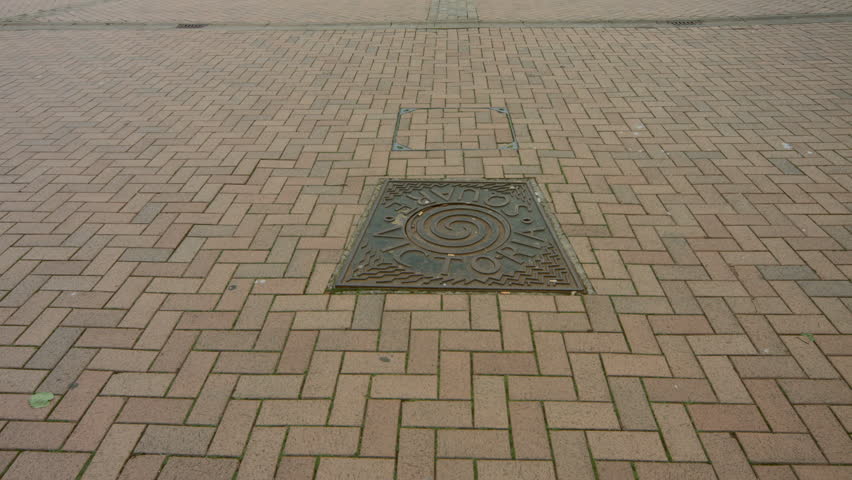 Birmingham, England - Victoria Square early morning. Tilt up to the Council House from a floor plaque. 4K UHD