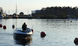 Boat leaving the dock in south harbour, in Hanko, Finland