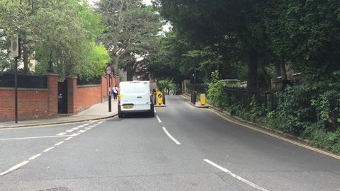 LONDON - JULY 26: Vehicles slow down to drive through speed control bollards in a residential area of Hampstead on July 26, 2016 in North London, UK.