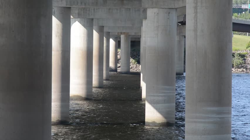 Bridge Pillars. River Flowing 