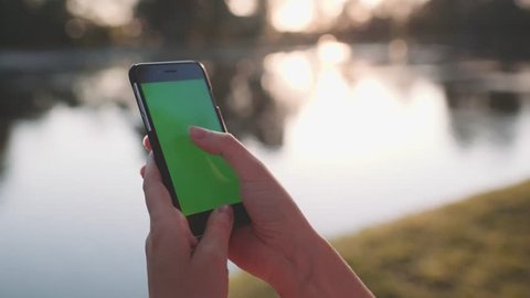 Hands holding and using business smartphone CHROMA KEY. SLOW MOTION 120 fps 4K. 