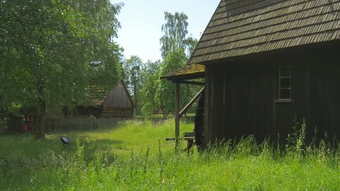Gloomy Wooden Building in a Wooded Area. Broken Water Mill. Fragments of Ancient Buildings in the Park Polish Architecture