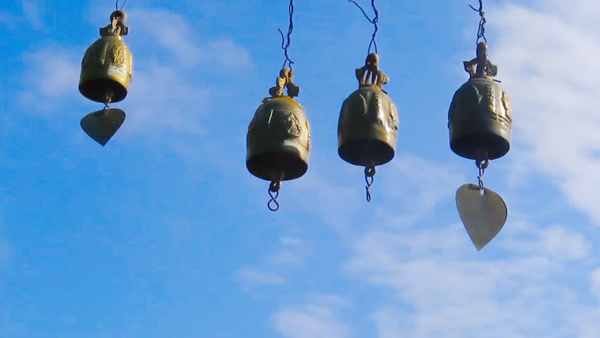 wind chimes on blue sky background 