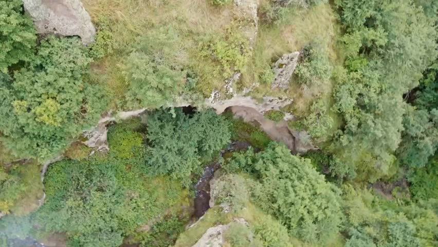 Deep green canyon under the suspension bridge in Khndzoresk, Armenia