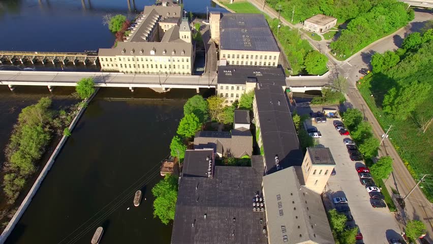 Aerial tour of scenic Fox River waterfront on a springtime morning, Appleton, Wisconsin.