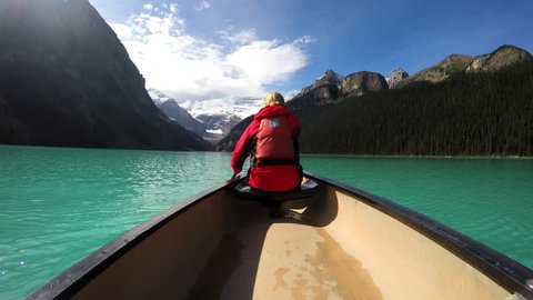 View of female Kayaking Lake Louise Alberta Canada