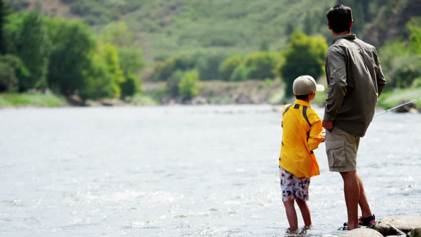 Caucasian male parent and child fishing on Colorado River on holiday outdoor Royalty-Free Stock Footage #18304813