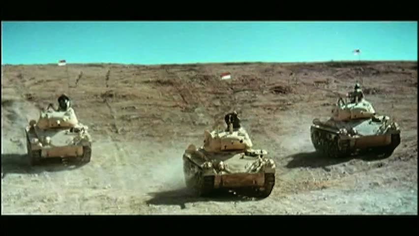 Wide shot military tanks in desert