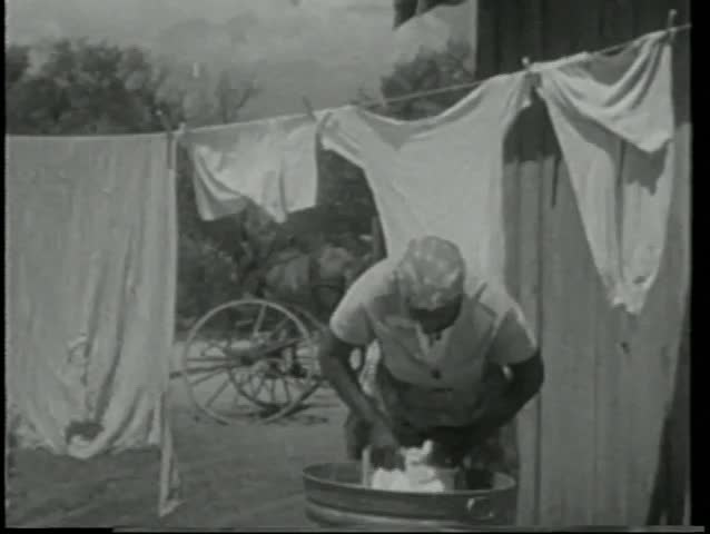 Woman washing clothes by hand