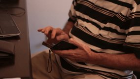 Smooth Slider Shot of Senior Man Using Cellphone
