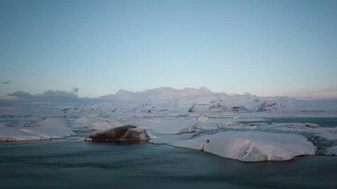 4K Time lapse close up of icebergs moving in the Glacier Lagoon Jokulsarlon in Iceland at sunrise in the morning