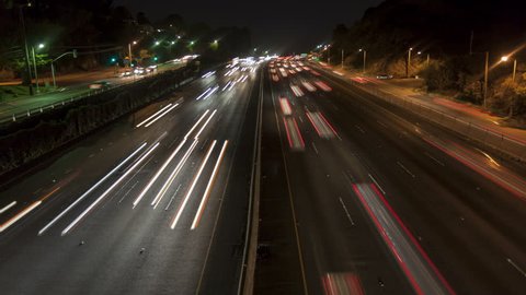 4K Time lapse night motion light trails on a busy Los Angeles freeway