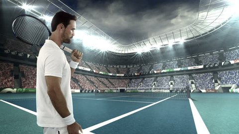Tennis player tossing a ball in the air while holding his racquet in stadium
