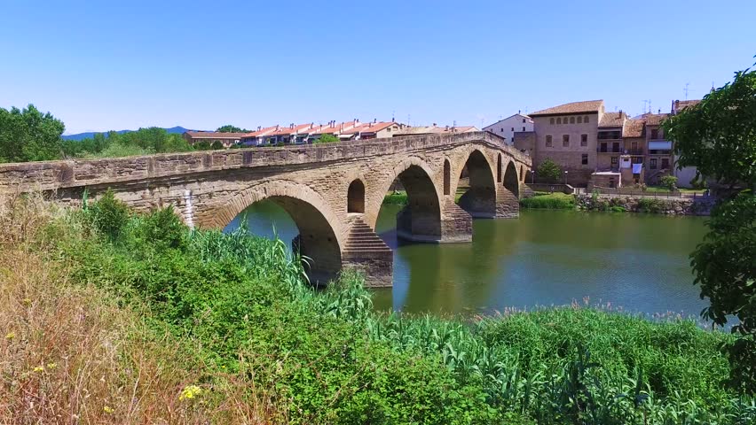 Ancient roman bridge across the Arga river in Puente la Reina, near Pamplona, Navarra, Spain
