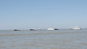 LA TRANCHE-SUR-MER, FRANCE - JULY 2016: Vendee department beach tide low and  yachts on ocean scenery by the day