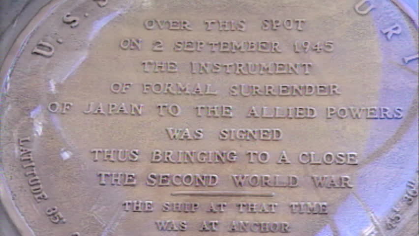 Archive 1991 USS Missouri tied up at dock. Japanese surrender plaque close up, readable.
