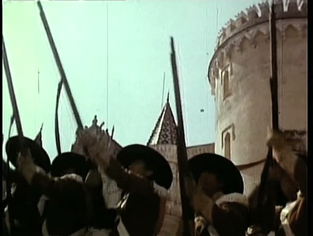 Small group of soldiers shooting rifles upward