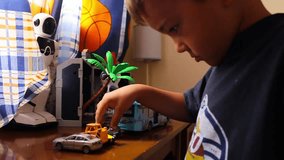 Boy playing toy cars