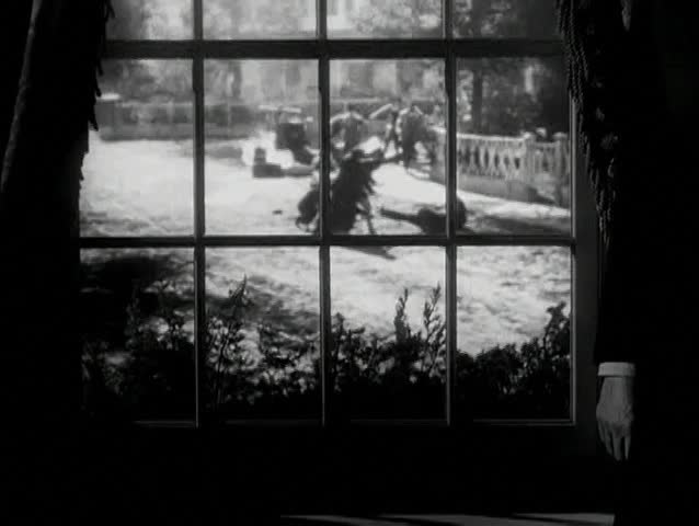 View of street fight through window