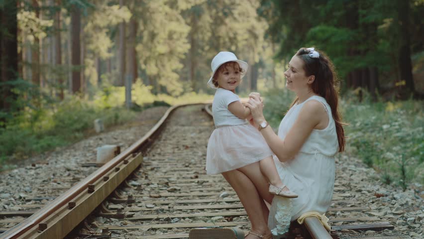 Pregnant mother having good time with her little daughter, Red Epic slow motion