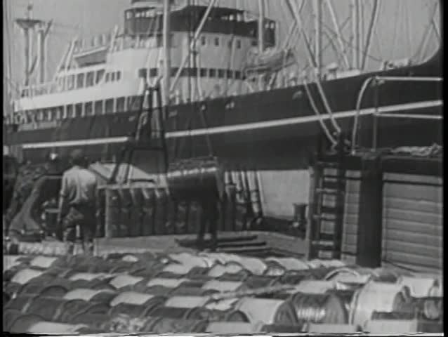 Men unloading cargo from ship
