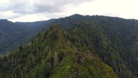 Aerial footage - Free climbing a cliff on top of mountain in Smoky Mountains