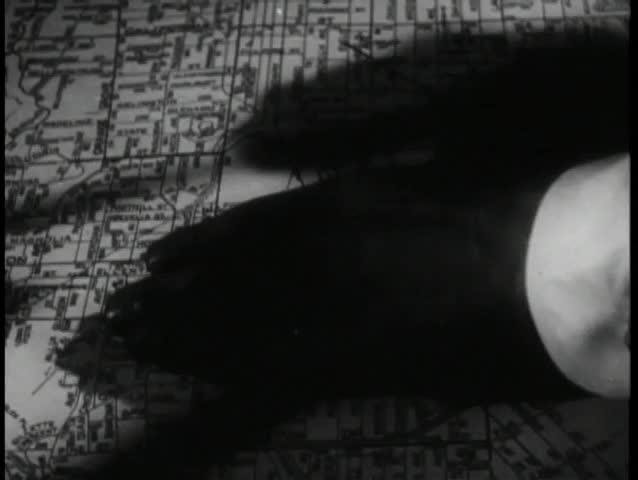 Close-up hand drawing circle on city map